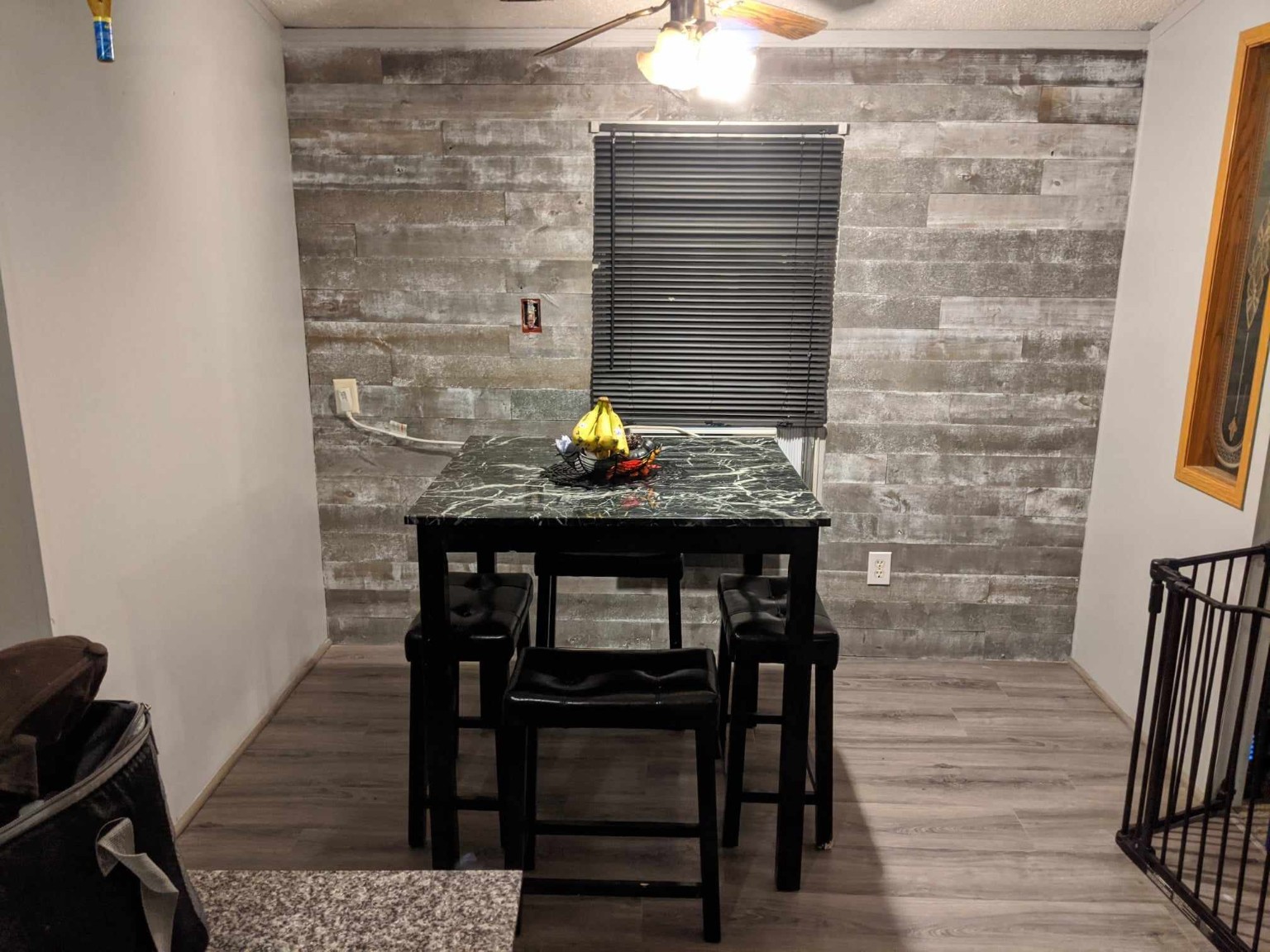 Finished gray plank dining room accent wall