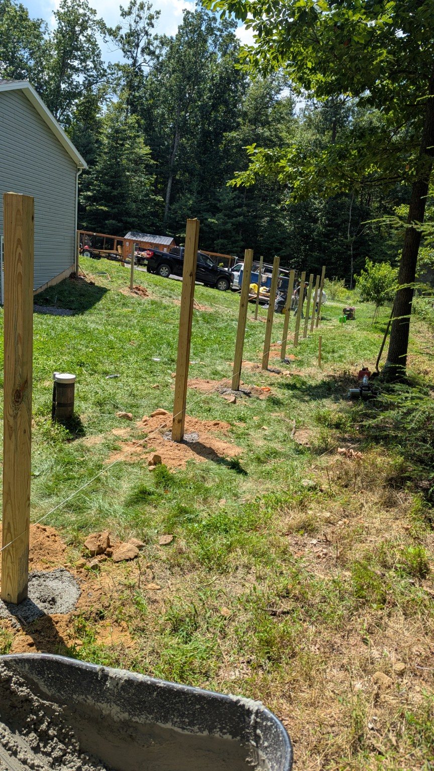 Fence posts set along a layout line