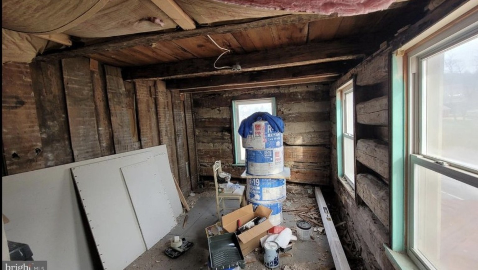 Renovation room with construction materials and debris