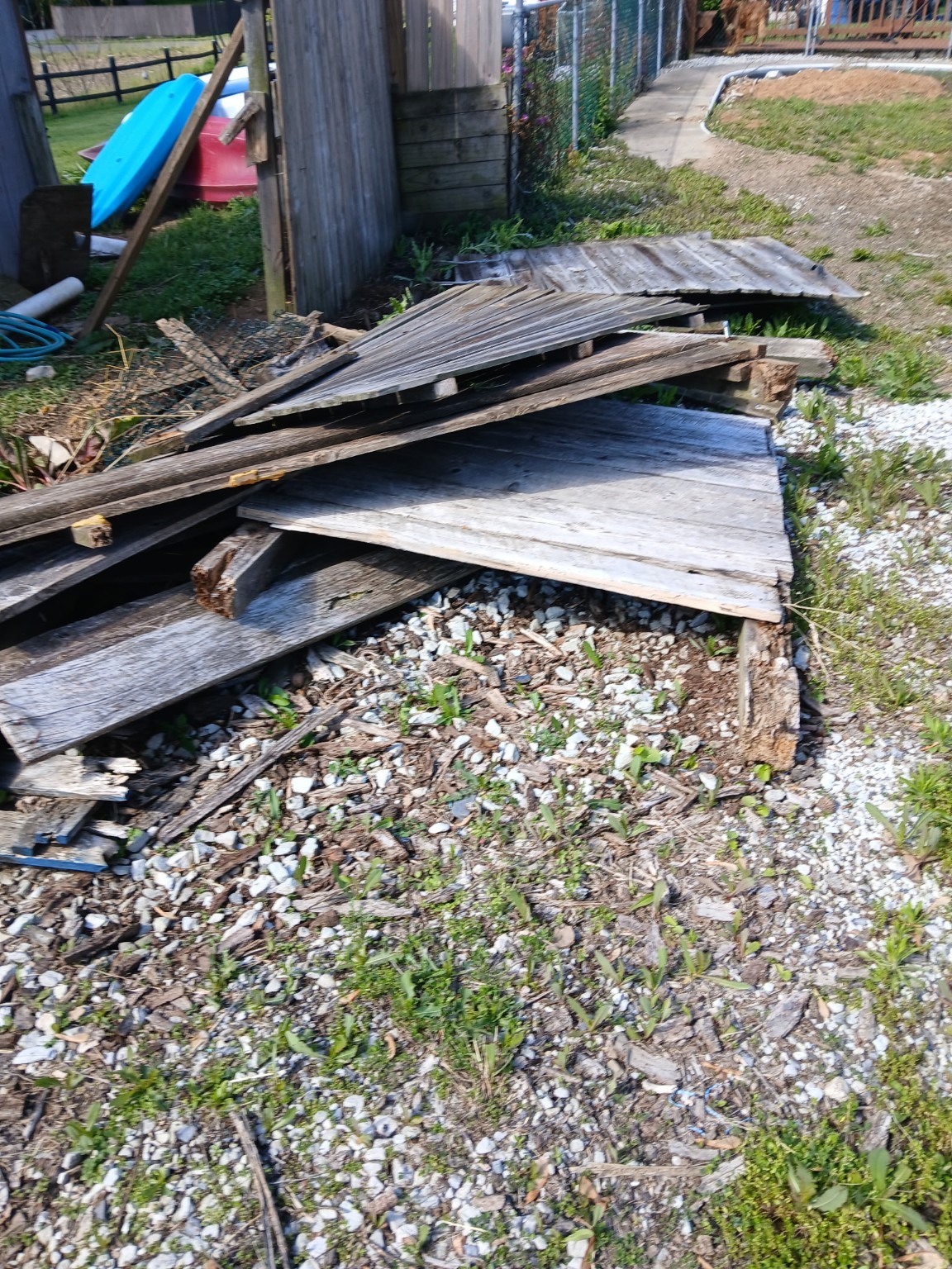 Old wood and broken outdoor materials ready for junk removal